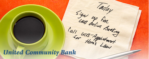 Cup of coffee with a napkin note to sign up for online banking.